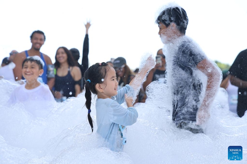 Children participate in the Bubble Run in Pomona, Los Angeles County, California, the United States, Aug. 29, 2026. More than 10,000 people took part in the annual Bubble Run on Saturday at the Pomona Fairplex in Pomona, east of Los Angeles, enjoying a day of running, colorful bubbles and family fun. (Photo by Zeng Hui/Xinhua)