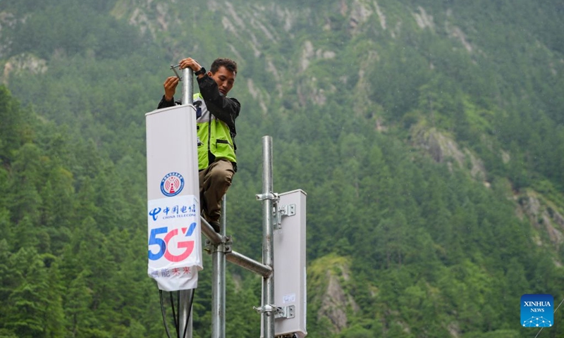 A staff member works on a signal base station in Gyirong Town, southwest China's Xizang Autonomous Region, Aug. 29, 2026. The telecommunication sector has been making all-out efforts to restore the communication infrastructure affected by the mudslide in Gyirong, and to ensure unimpeded emergency communications. So far, one base station has been restored, and 3 new base stations have been built. (Xinhua/Jigme Dorje)