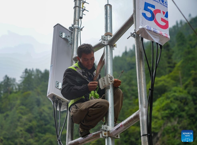 A staff member works on a signal base station in Gyirong Town, southwest China's Xizang Autonomous Region, Aug. 29, 2026. The telecommunication sector has been making all-out efforts to restore the communication infrastructure affected by the mudslide in Gyirong, and to ensure unimpeded emergency communications. So far, one base station has been restored, and 3 new base stations have been built. (Xinhua/Jigme Dorje)