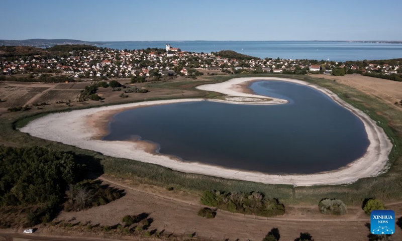This aerial drone photo taken on Aug. 29, 2026 shows a view of the Inner Lake of Tihany in Tihany, Hungary. The Inner Lake of Tihany, located on Hungary's Tihany Peninsula, is a scenic volcanic crater lake. (Photo by David Balogh/Xinhua)