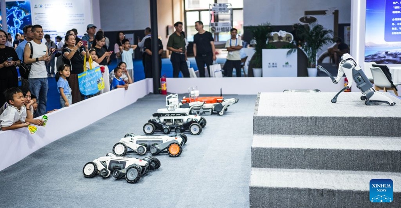 People watch robotic dogs' performance at the 2026 China International Big Data Industry Expo in Guiyang, southwest China's Guizhou Province, Aug. 28, 2026. The expo kicked off here on Friday, showcasing the cutting-edge technologies in several key sectors including computing power infrastructure, data supply, model-driven innovation, security safeguards, and intelligent experiences. Photo: Xinhua