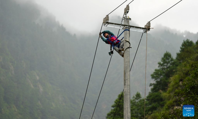 A staff member check power cables near mudslide-hit Gyirong Port in Gyirong County, southwest China's Xizang Autonomous Region, Aug. 29, 2026. Staff members of the local power company has set up an emergency power transformer not far from the mudslide-hit Gyirong Port, as part of their efforts to ensure power supply for all rescue operations. Power supply is gradually restored in the mudslide-hit areas. (Xinhua/Jigme Dorje)