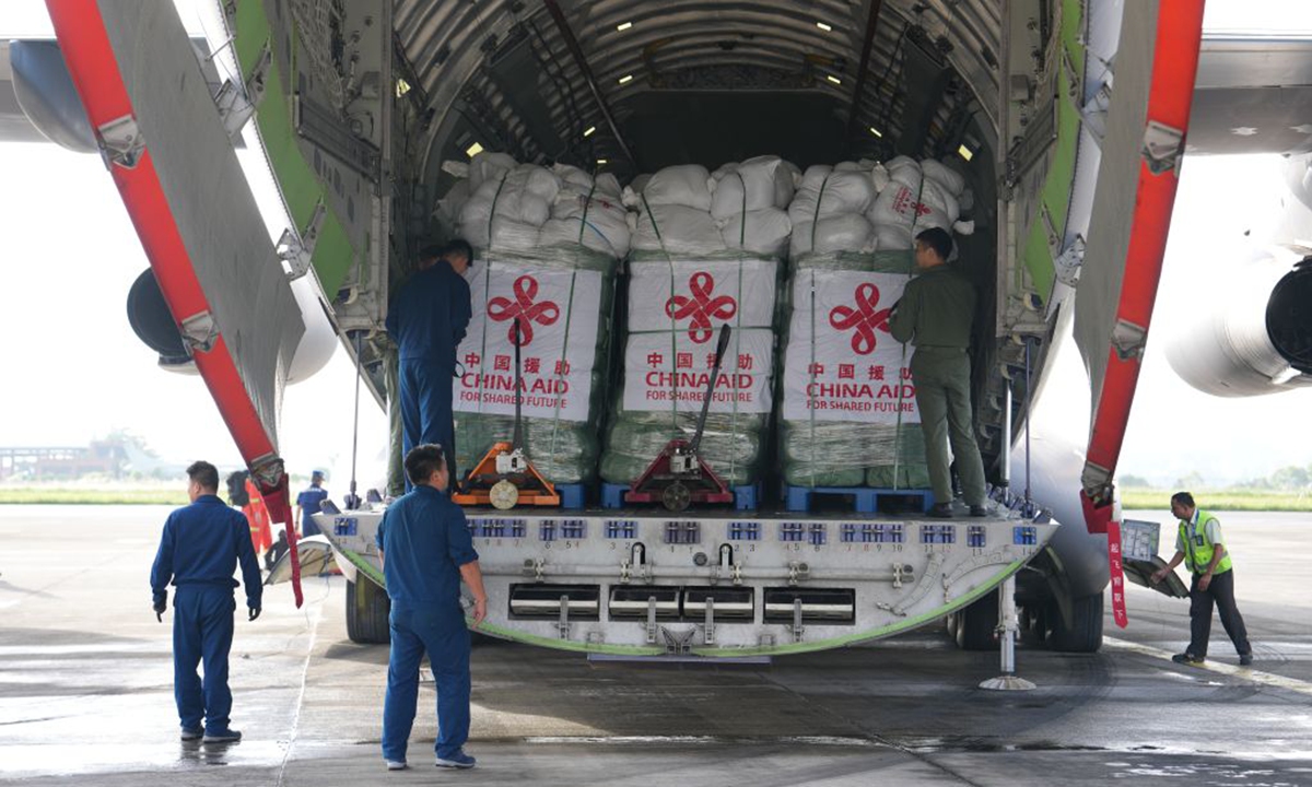 Staff members prepare to unload Chinese relief supplies at Tribhuvan International Airport in Kathmandu, Nepal, Aug. 30, 2026. Carried by two Y-20 transport planes, Chinese relief supplies and four Chinese rescue experts arrived here at about 7 a.m. local time on Sunday to assist in disaster relief efforts. (Xinhua)