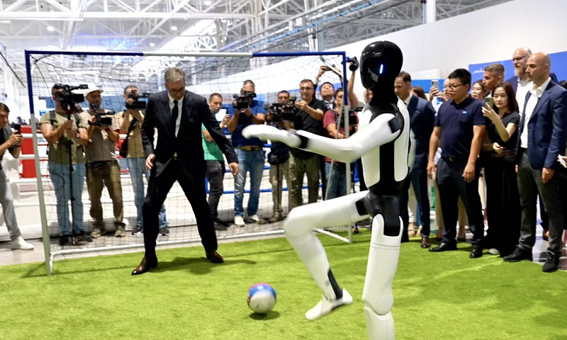 Serbian President Aleksandar Vucic plays football with a humanoid robot at a joint robot mass-production base in Sabac, Serbia on August 29, 2026. Photo: Courtesy of Jiaxing government media center 