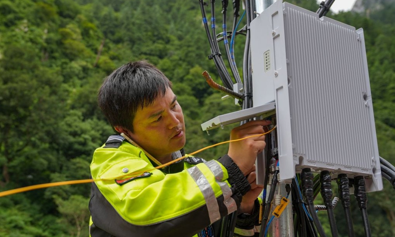 A staff member works on a base station in Gyirong Town, southwest China's Xizang Autonomous Region, Aug. 29, 2026. The telecommunication sector has been making all-out efforts to restore the communication infrastructure affected by the mudslide in Gyirong, and to ensure unimpeded emergency communications. So far, one base station has been restored, and 3 new base stations have been built. (Xinhua/Jigme Dorje)