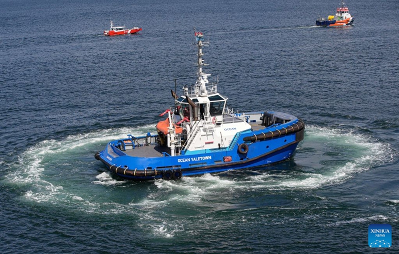 A tugboat performs high-speed turns during a marine demonstration at the Port Day event in Vancouver, British Columbia, Canada, Aug. 29, 2026. The annual event showcased the local maritime industry and its role in moving Canadian trade, featuring marine demonstrations and interactive exhibits that allowed the public to learn about local port operations and safety practices. (Photo by Liang Sen/Xinhua)