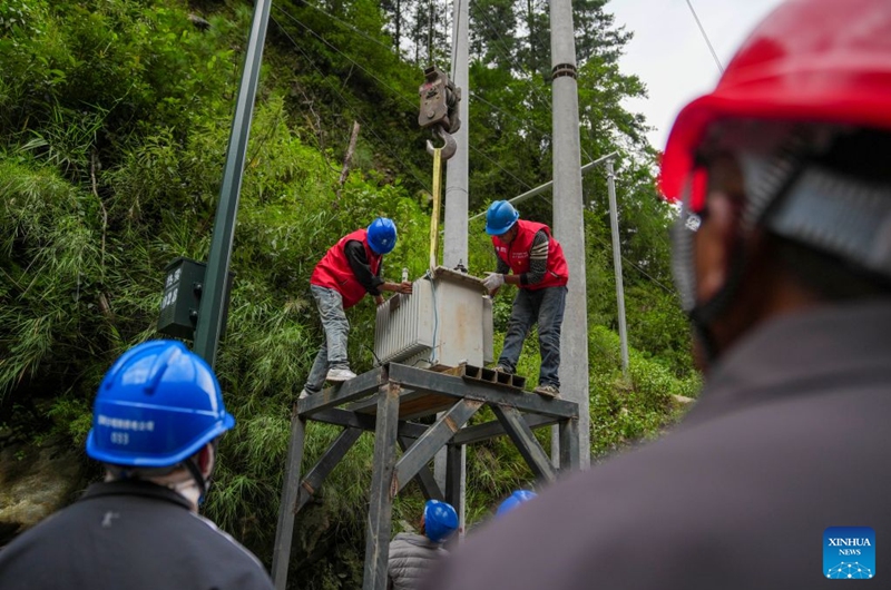 Staff members install a power transformer about 3 kilometers from mudslide-hit Gyirong Port in Gyirong County, southwest China's Xizang Autonomous Region, Aug. 29, 2026. Staff members of the local power company has set up an emergency power transformer not far from the mudslide-hit Gyirong Port, as part of their efforts to ensure power supply for all rescue operations. Power supply is gradually restored in the mudslide-hit areas. (Xinhua/Jigme Dorje)