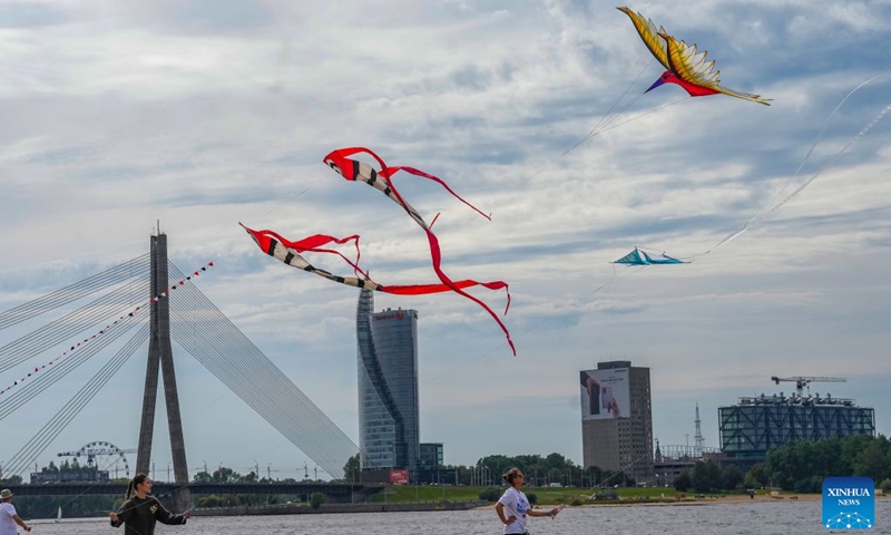 People fly kites during the Riga International Kite Festival in Riga, Latvia, Aug. 29, 2026. (Photo by Edijs Palens/Xinhua)