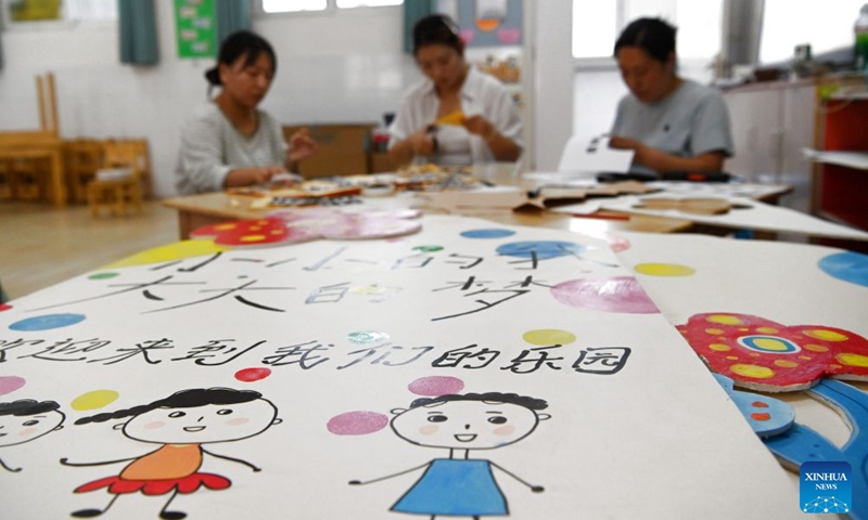 Teachers decorate a classroom at a kindergarten in Qinyang City of central China's Henan Province, Aug. 28, 2026. Various departments across the country are getting ready for the upcoming new semester. (Photo by Yang Fan/Xinhua)