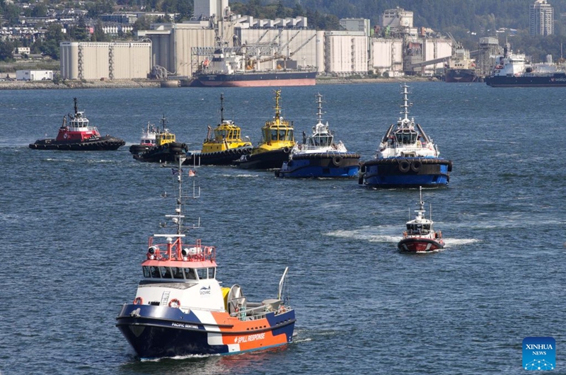Boats take part in a marine demonstration during the Port Day event in Vancouver, British Columbia, Canada, Aug. 29, 2026. The annual event showcased the local maritime industry and its role in moving Canadian trade, featuring marine demonstrations and interactive exhibits that allowed the public to learn about local port operations and safety practices. (Photo by Liang Sen/Xinhua)