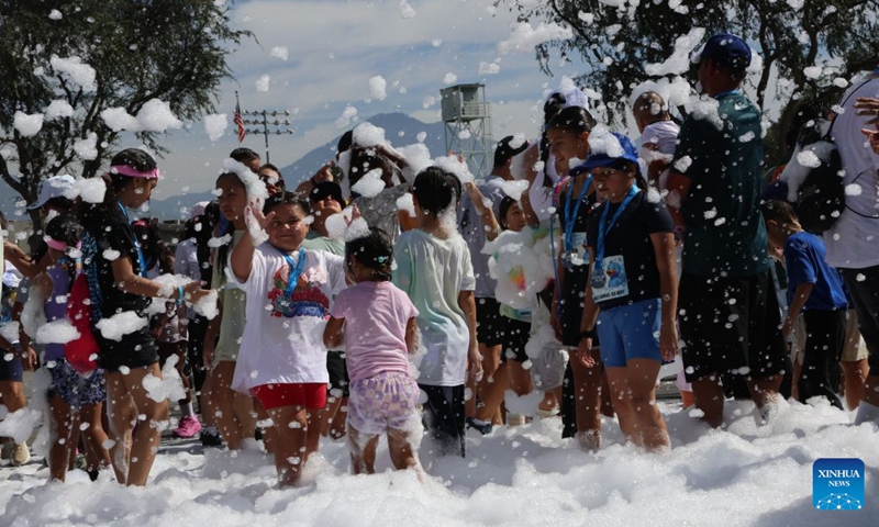 People participate in the Bubble Run in Pomona, Los Angeles County, California, the United States, Aug. 29, 2026. More than 10,000 people took part in the annual Bubble Run on Saturday at the Pomona Fairplex in Pomona, east of Los Angeles, enjoying a day of running, colorful bubbles and family fun. (Photo by Zeng Hui/Xinhua)