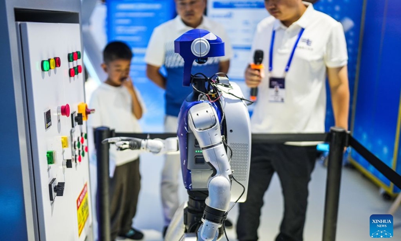 A staff member operates a power inspection robot with vocal commands at the 2026 China International Big Data Industry Expo in Guiyang, southwest China's Guizhou Province, Aug. 28, 2026. The expo kicked off here on Friday, showcasing the cutting-edge technologies in several key sectors including computing power infrastructure, data supply, model-driven innovation, security safeguards, and intelligent experiences. Photo: Xinhua