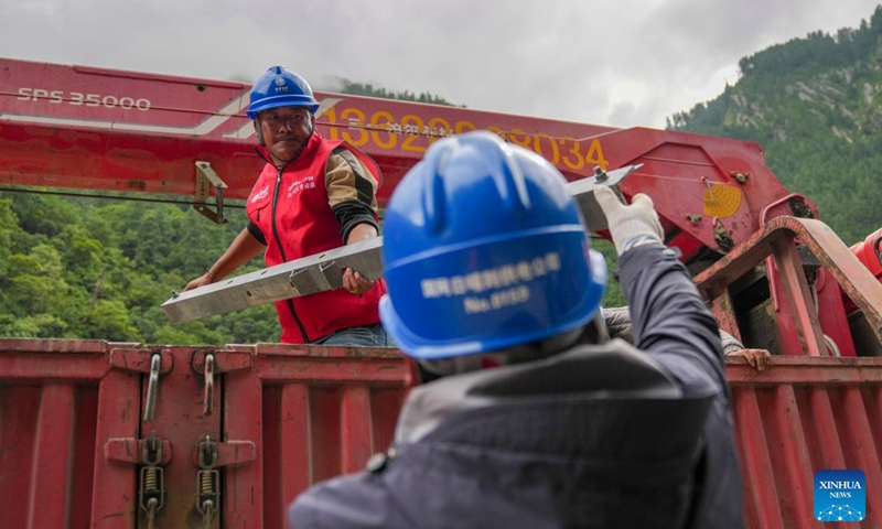 Staff members install a power transformer about 3 kilometers from mudslide-hit Gyirong Port in Gyirong County, southwest China's Xizang Autonomous Region, Aug. 29, 2026. Staff members of the local power company has set up an emergency power transformer not far from the mudslide-hit Gyirong Port, as part of their efforts to ensure power supply for all rescue operations. Power supply is gradually restored in the mudslide-hit areas. (Xinhua/Jigme Dorje)