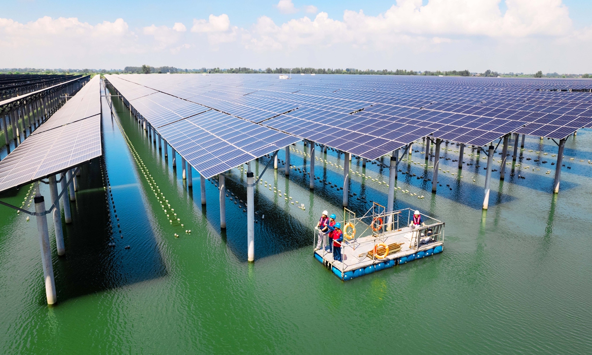 Staff from State Grid Tianchang Power Supply Co inspect photovoltaic modules and grid-connected equipment at the 150-megawatt fishery-solar complementary power station in Tianchang, East China's Anhui Province on August 30, 2026. Photo: VCG