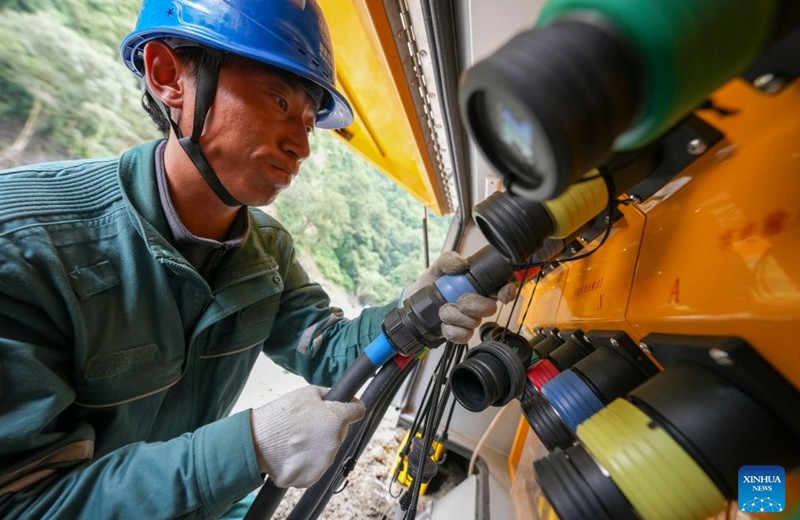 A staff member connect low-voltage output cables near the mudslide-hit Gyirong Port, in Gyirong County, southwest China's Xizang Autonomous Region, Aug. 29, 2026. Staff members of the local power company has set up an emergency power transformer not far from the mudslide-hit Gyirong Port, as part of their efforts to ensure power supply for all rescue operations. Power supply is gradually restored in the mudslide-hit areas. (Xinhua/Jigme Dorje)