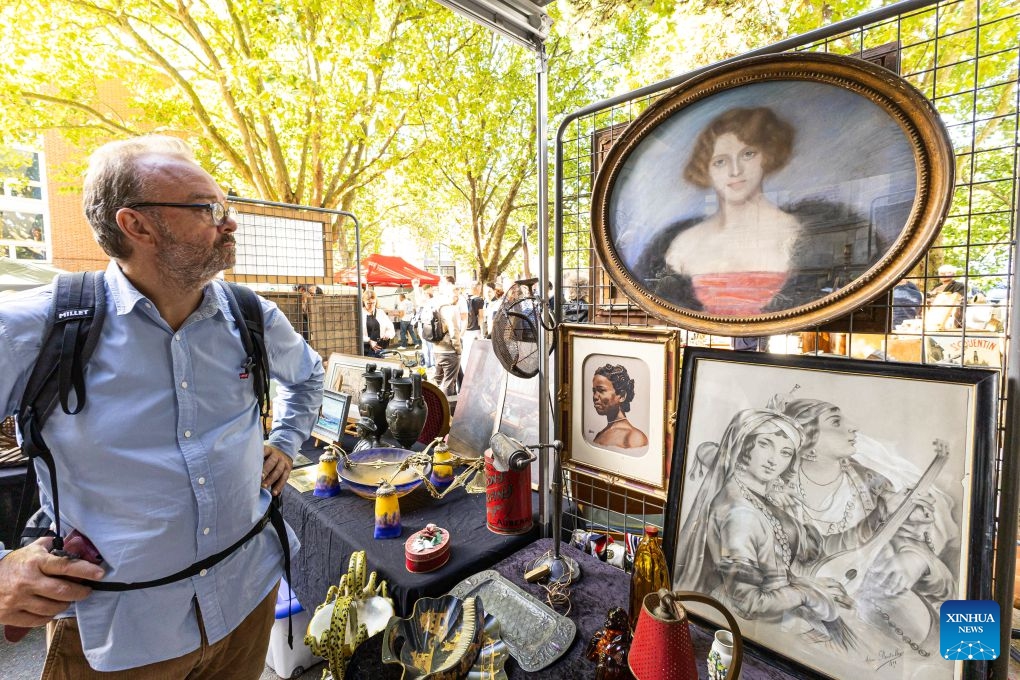 A visitor looks at items during the Lille Braderie 2026 in Lille, north France, Sept. 5, 2026. The annual Lille Braderie, one of Europe's largest flea markets, kicked off on Saturday. (Photo: Xinhua)