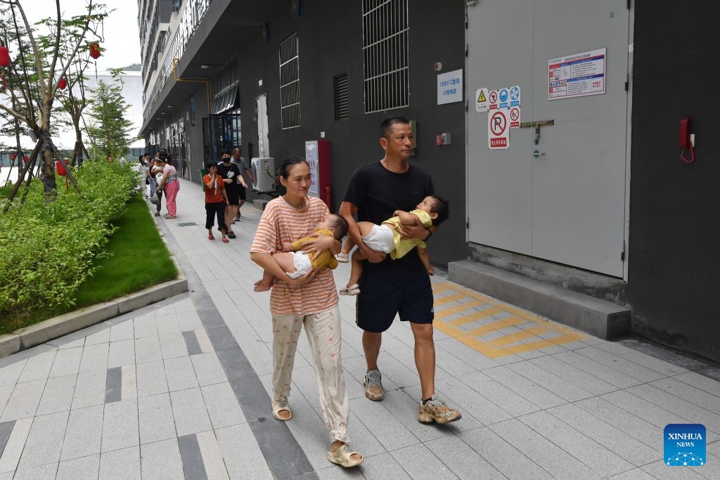 Relocated residents arrive at a resettlement site in Putian City, southeast China's Fujian Province, Sept. 5, 2026. As this round of heavy rainfall in Putian concluded on Saturday, floodwaters gradually receded in areas including Huating Town, which had been severely inundated by Typhoon Saudel. Local authorities have since shifted to post-disaster recovery, undertaking tasks including road clearance, water and power restoration, environmental dredging, and the resettlement of affected residents. (Photo: Xinhua)