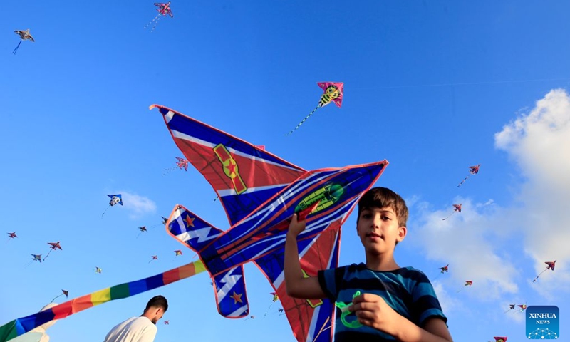 A child holds a kite during an annual kite festival in Zrariyeh, southern Lebanon, Sept. 4, 2026. (Photo: Xinhua)
