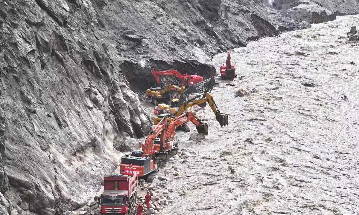 Rescue crews work to reopen a damaged section of the G216 national highway in Gyirong County, Xigaze, Southwest China's Xizang Autonomous Region, on August 31, 2026. By 4 pm, operations had advanced to 1.1 kilometers from Gyirong Port, with 158 personnel and 28 pieces of heavy equipment from China Anneng deployed. The highway, the only land route to the port, was cut off by the mudslide on August 26, 2026. Photo: VCG