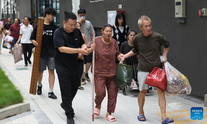 Relocated residents arrive at a resettlement site in Putian City, southeast China's Fujian Province, Sept. 5, 2026. As this round of heavy rainfall in Putian concluded on Saturday, floodwaters gradually receded in areas including Huating Town, which had been severely inundated by Typhoon Saudel. Local authorities have since shifted to post-disaster recovery, undertaking tasks including road clearance, water and power restoration, environmental dredging, and the resettlement of affected residents. (Photo: Xinhua)