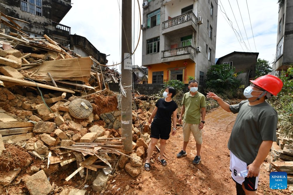Staff members check the damaged power equipment in Huating Town of Putian City, southeast China's Fujian Province, Sept. 5, 2026. As this round of heavy rainfall in Putian concluded on Saturday, floodwaters gradually receded in areas including Huating Town, which had been severely inundated by Typhoon Saudel. Local authorities have since shifted to post-disaster recovery, undertaking tasks including road clearance, water and power restoration, environmental dredging, and the resettlement of affected residents. (Photo: Xinhua)