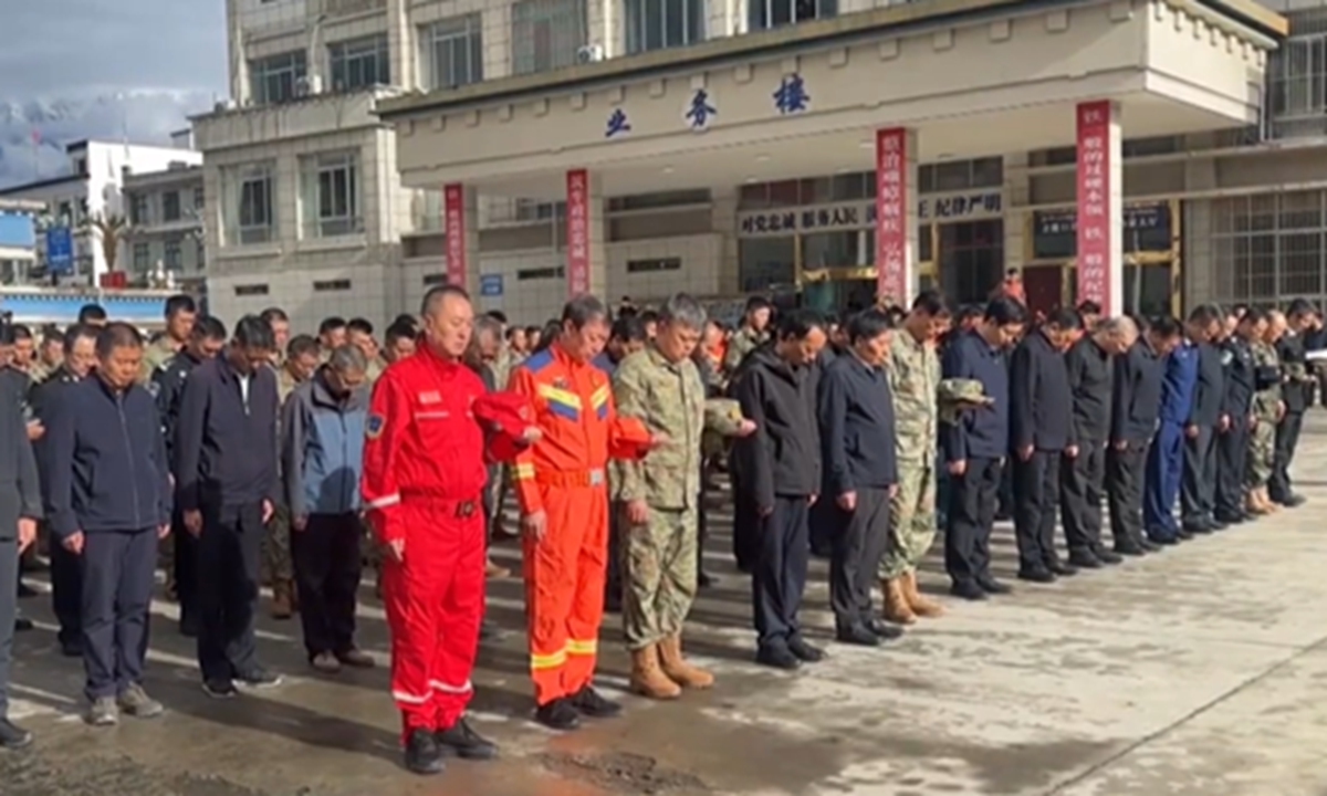 A memorial ceremony was held for the victims of the mudslide at the Gyirong Port branch of the Xigaze public security bureau in Southwest China's Xizang Autonomous Region. Photo: Screenshot from Xinhua