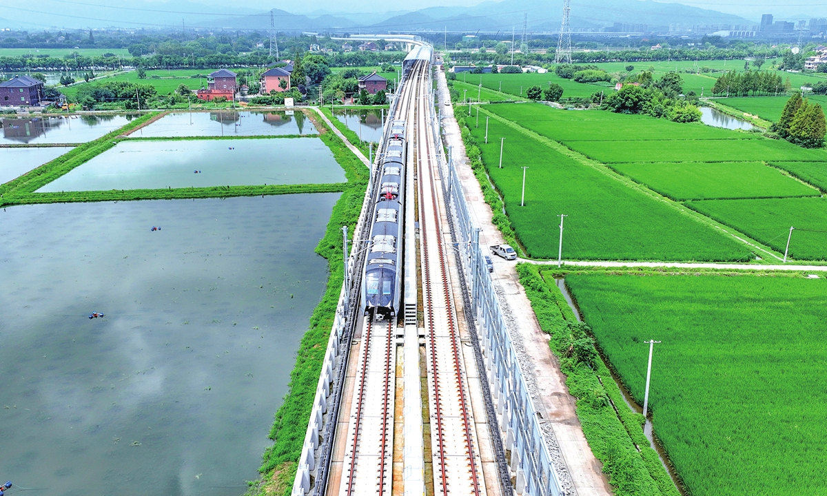 A trial train runs on the Hangzhou-Deqing intercity railway in Deqing, East China's Zhejiang Province, on September 1, 2026. The 25.6-kilometer line has nine stations and is the first intercity railway linking Hangzhou and Huzhou. The line is expected to open by the end of December. Photo: VCG
