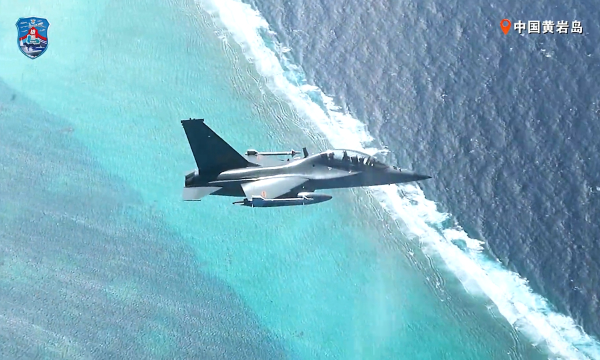A JL-10 advanced trainer jet carrying live missiles flies over Huangyan Dao. Photo: Screenshot from the video of PLA Southern Theater Command Wechat account