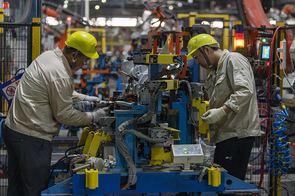 Industrial robots operate at high speed as new-energy vehicle parts roll off the production line at an intelligent workshop in Xiaoshun township of Jinhua city, East China's Zhejiang Province, on September 3, 2026. Official data showed that China exported 6.41 million vehicles in the first seven months of 2026, up 54 percent year-on-year. Photo: VCG
