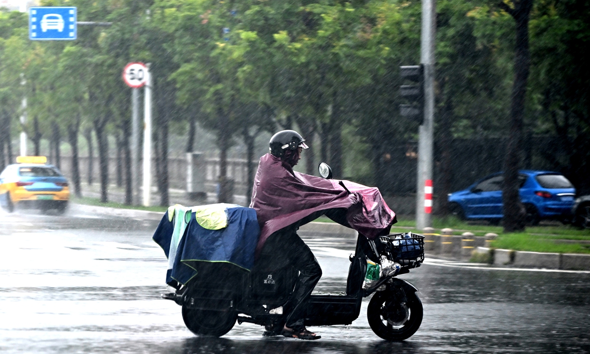 A man rides in the rain on September 3, 2026, in Fuzhou, East China's Fujian Province. Photo: IC 