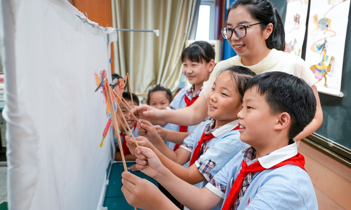 Students experience a traditional shadow puppetry performance, an item of China's intangible cultural heritage, at a school in Taizhou, East China's Jiangsu Province, on September 2, 2026. Photo: VCG