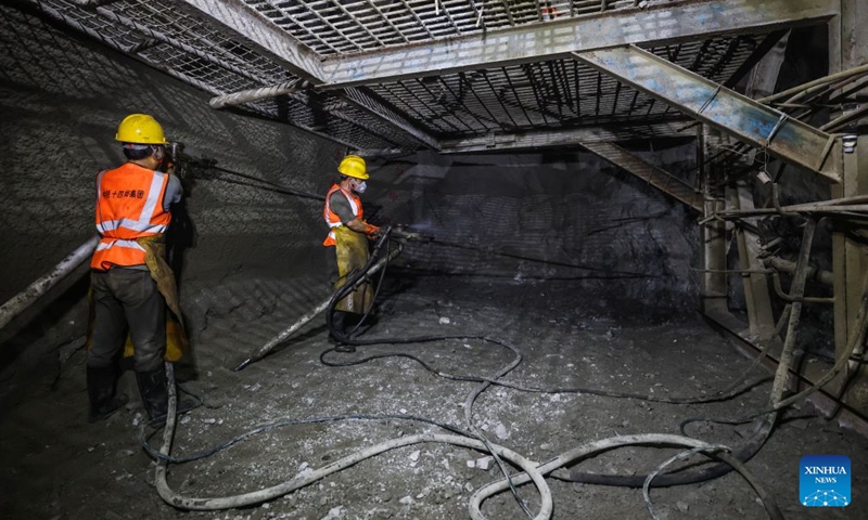Construction workers work at the entrance of the Jintang undersea tunnel, east China's Zhejiang Province, Sept. 4, 2026. The 7.83-km land section of the 16.18-km Jintang undersea tunnel achieved full breakthrough on Friday. The tunnel is an important facility for the Yongzhou (Ningbo-Zhoushan) high-speed railway, and is designed as a single-bore, double-track tunnel for speeds of up to 250 km per hour. (Xinhua/Xu Yu)

