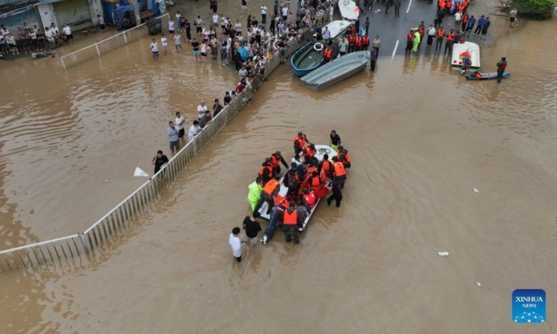An aerial drone photo taken on Sept. 4, 2026 shows rescuers evacuating stranded people at the Hualin economic development zone in Putian City, southeast China's Fujian Province. Continuous torrential rains led to severe waterlogging at the Hualin economic development zone in Putian. The local authorities immediately organized rescue forces to evacuate over 3,000 stranded workers in the zone to safe areas. (Xinhua/Jiang Kehong)