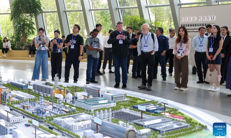 Guests visit Chinese wind turbine maker Mingyang Smart Energy Group in Zhongshan City, south China's Guangdong Province, Sept. 4, 2026.

