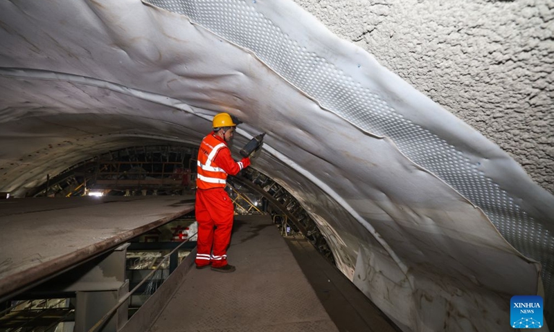 A construction worker works at the entrance of the Jintang undersea tunnel, east China's Zhejiang Province, Sept. 4, 2026. The 7.83-km land section of the 16.18-km Jintang undersea tunnel achieved full breakthrough on Friday. The tunnel is an important facility for the Yongzhou (Ningbo-Zhoushan) high-speed railway, and is designed as a single-bore, double-track tunnel for speeds of up to 250 km per hour. (Xinhua/Xu Yu)

