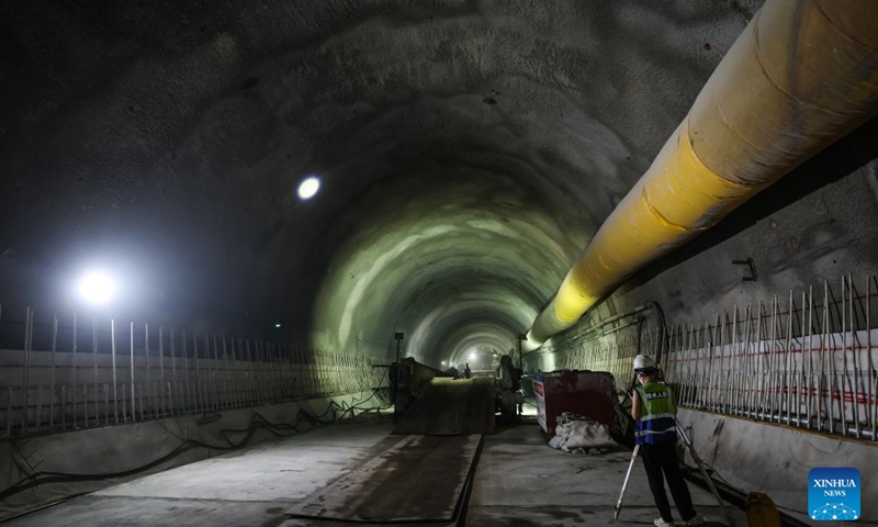 Construction workers inspect the condition of the entrance of the Jintang undersea tunnel, east China's Zhejiang Province, Sept. 4, 2026. The 7.83-km land section of the 16.18-km Jintang undersea tunnel achieved full breakthrough on Friday. The tunnel is an important facility for the Yongzhou (Ningbo-Zhoushan) high-speed railway, and is designed as a single-bore, double-track tunnel for speeds of up to 250 km per hour. (Xinhua/Xu Yu)

