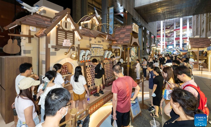 People visit a touring exhibition launched by Pop Mart at the Shanghai No.1 Department Store in east China's Shanghai, Sept. 3, 2026. Chinese pop culture giant Pop Mart launched a touring exhibition on Monday, with Shanghai as its first stop. Running until November 1, the exhibition uses the Oriental Pearl Tower and the Shanghai No.1 Department Store as its venues, integrating designer toy culture into Shanghai's commercial districts. (Xinhua/Wang Xiang)

