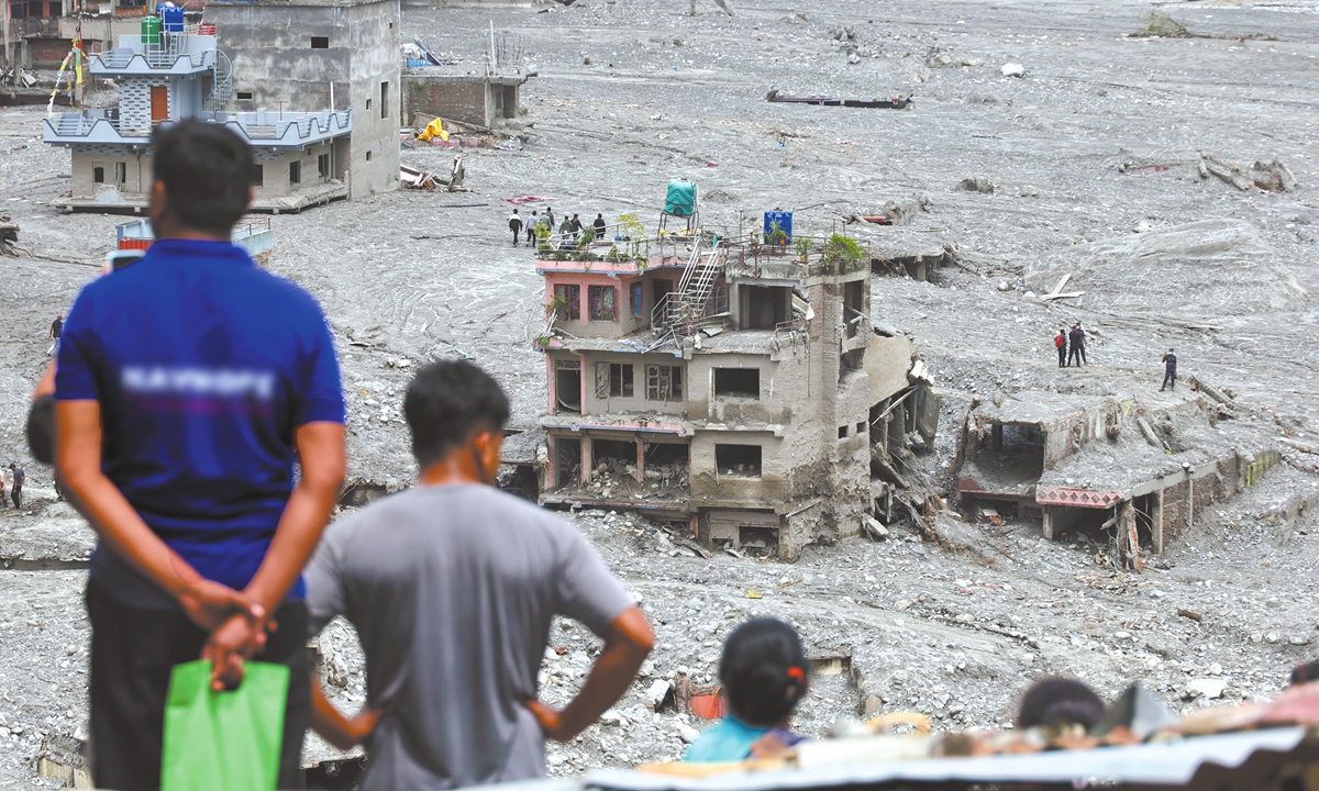 A photo taken on September 6, 2026, shows a village in Bidur, Nepal, that was devastated by massive flooding, with buildings swept away or buried under mud and debris. Photo: VCG