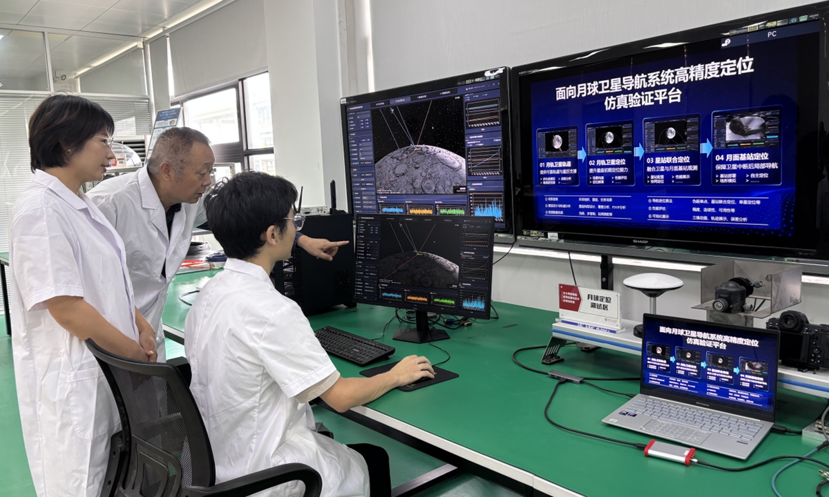 Researchers from Guangdong University of Technology work on the newly unveiled high-precision simulation and verification platform for lunar satellite navigation system. Photo: Courtesy of the research team