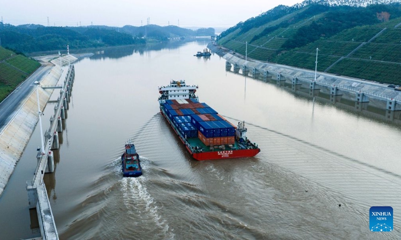 An aerial drone photo taken on Sept. 7, 2026 shows a Panama-flagged container ship sailing along the Pinglu Canal in south China's Guangxi Zhuang Autonomous Region.(Xinhua/Zhang Ailin)