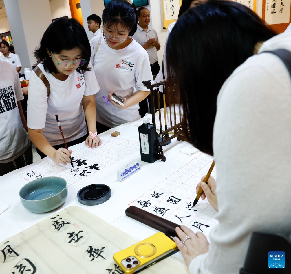 People write Chinese calligraphy during an event to celebrate the upcoming Mid-Autumn Festival at the China Cultural Center in Yangon, Myanmar, Sept. 12, 2026. (Xinhua/Myo Kyaw Soe)
