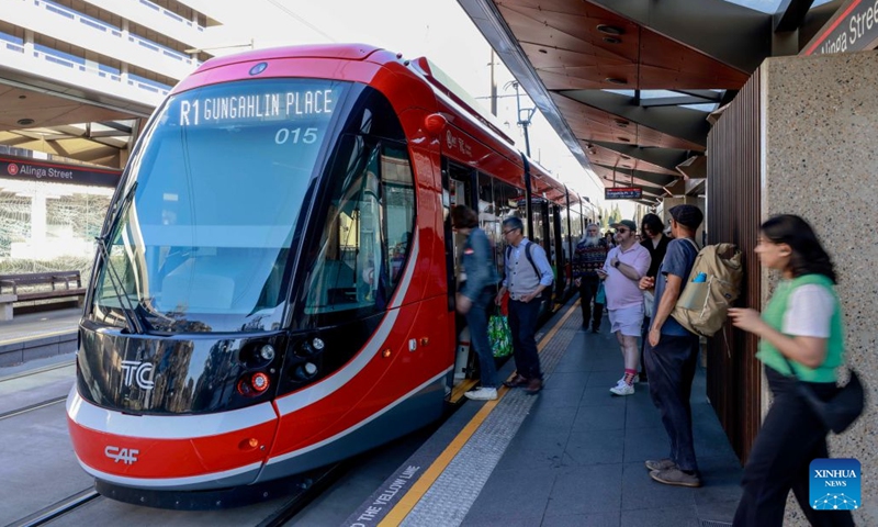 People board a light rail train in Canberra, Australia, on Sept. 12, 2026. Australia recorded 710,980 short-term visitor arrivals in July 2026, down 4.3 percent from the same month a year earlier, official data showed on Friday. (Photo by Chu Chen/Xinhua)