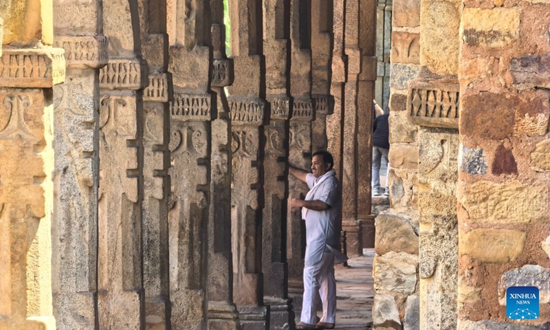 This photo taken with a mobile phone shows a man visiting Qutb Minar in New Delhi, India, Sept. 9, 2026. The Qutb Minar, or Qutab Minar, was originally built in the 12th century and was inscribed on the World Heritage List by the United Nations Educational, Scientific and Cultural Organization (UNESCO) in 1993. India is a country with a long-standing civilization. Its capital, New Delhi, located on the banks of the Yamuna River, serves as the country's political and cultural center. (Xinhua/Yan Yan)