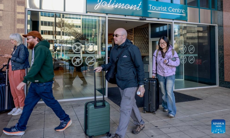 People walk out of a tourist centre in Canberra, Australia, on Sept. 12, 2026. Australia recorded 710,980 short-term visitor arrivals in July 2026, down 4.3 percent from the same month a year earlier, official data showed on Friday. (Photo by Chu Chen/Xinhua)