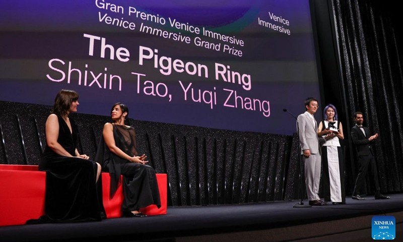 Director Zhang Yuqi (2nd R) and director Tao Shixin (3rd R) of the short film The Pigeon Ring attend the awarding ceremony of the 83rd Venice International Film Festival in Venice, Italy, Sept. 12, 2026. Chinese short film The Pigeon Ring won the Venice Immersive Grand Prize, the top award of the Venice Immersive section, at the 83rd Venice International Film Festival on Saturday. (Xinhua/Wang Kaiyan)