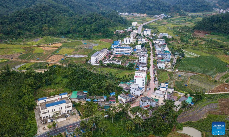 An aerial drone photo taken on Sept. 11, 2026 shows a view of the Maogan Township in Baoting Li and Miao Autonomous County, through which a scenic ring road surrounding the Hainan Tropical Rainforest National Park passes, in south China's Hainan Province. The scenic ring road surrounding the Hainan Tropical Rainforest National Park passes through nine cities and counties in Hainan, including Lingshui, Baoting, Ledong and Changjiang, with a total length of 466 kilometers. The ring road was officially opened to traffic in December 2024.
This road connects the beautiful scenery of the mountainous areas in the central and southern parts of Hainan Island and builds a green corridor that balances ecological protection and cultural tourism development.
At present, many tourists come to cycle and drive on the road, boosting tourism-related consumption including accommodation, catering, specialty agricultural products, and outdoor culture and tourism along the road. Photo: Xinhua