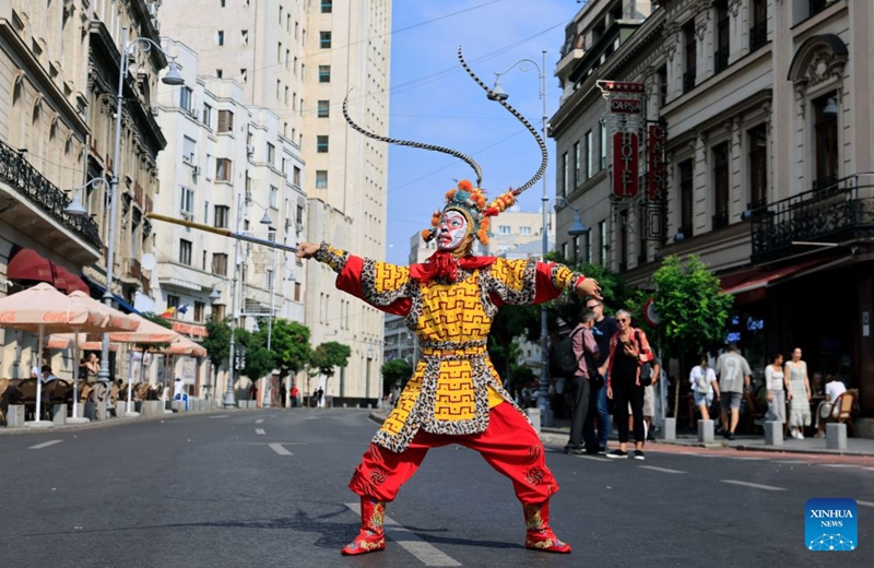 An artist performs at the Open Streets event under the theme of Discover Guangxi to promote the culture and traditions of south China's Guangxi Zhuang Autonomous Region, in Bucharest, Romania, Sept. 12, 2026. (Photo by Cristian Cristel/Xinhua)