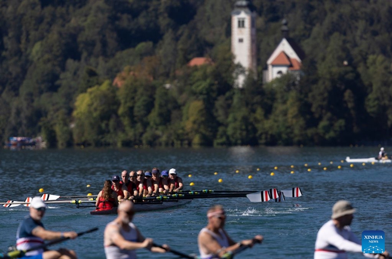 People participate in races on Lake Bled during the 2026 World Rowing Masters Regatta Bled in Bled, Slovenia, Sept. 12, 2026. (Photo by Zeljko Stevanic/Xinhua)