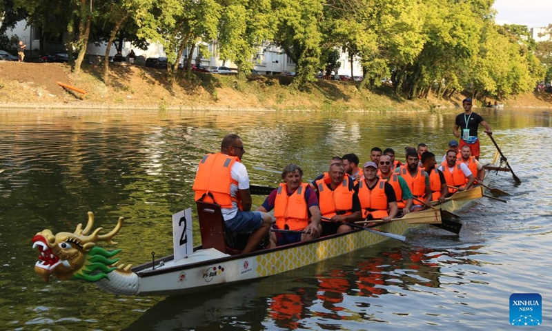 People experience dragon boat paddling at the Dragon Boat Festival in Yambol, Bulgaria, Sept. 12, 2026. The Fourth Dragon Boat Festival kicked off Saturday in Yambol, the administrative center of the Yambol Province in southeast Bulgaria, featuring dragon boat demonstrations and diverse cultural showcases. The two-day event also offers music and dance performances, martial arts demonstrations, a variety of artwork, and delectable Chinese and Bulgarian cuisines. (Xinhua/Zhou Hailun)