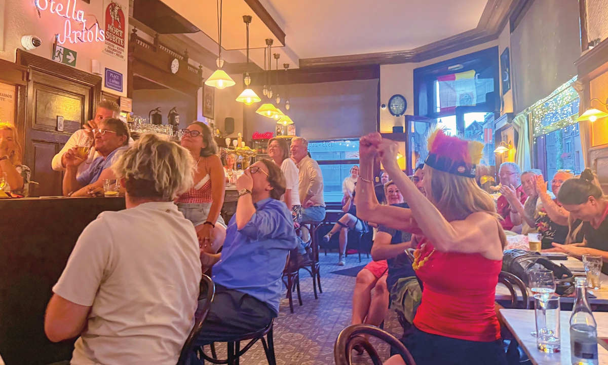 In a bar on Avenue Georges Henri in Brussels, fans cheer for the Belgian national team during the quarterfinals of the 2026 FIFA World Cup on July 10, 2026. Photo: Courtesy of Han Fei